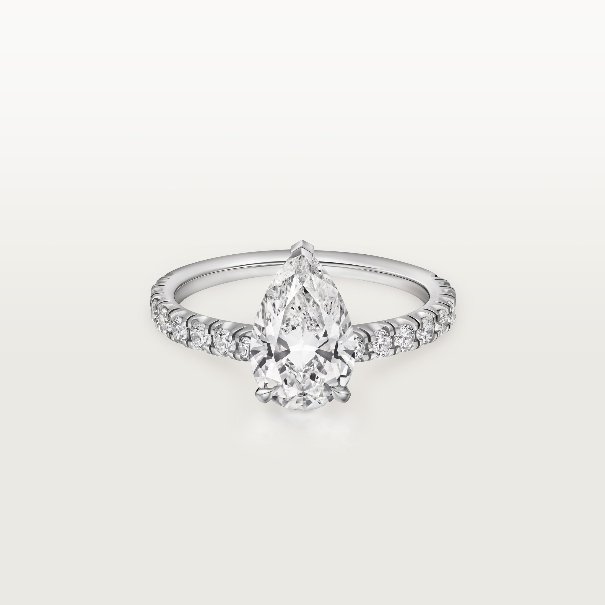 1895 solitaire, pear-shaped diamond, paved