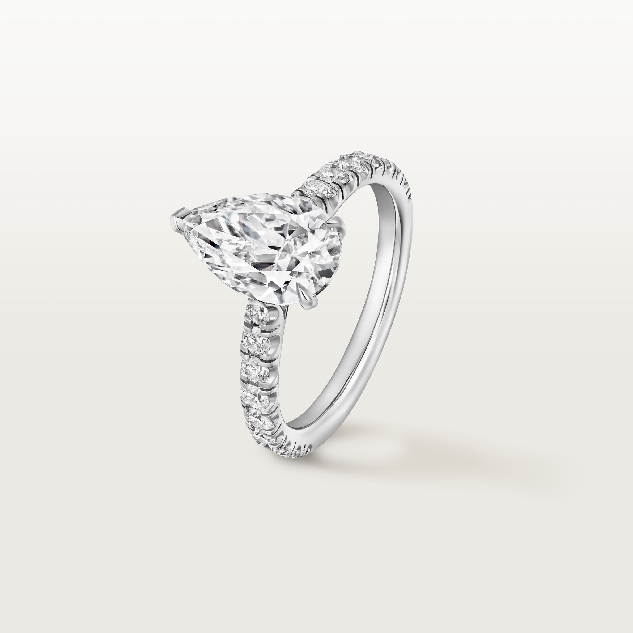 1895 solitaire, pear-shaped diamond, paved