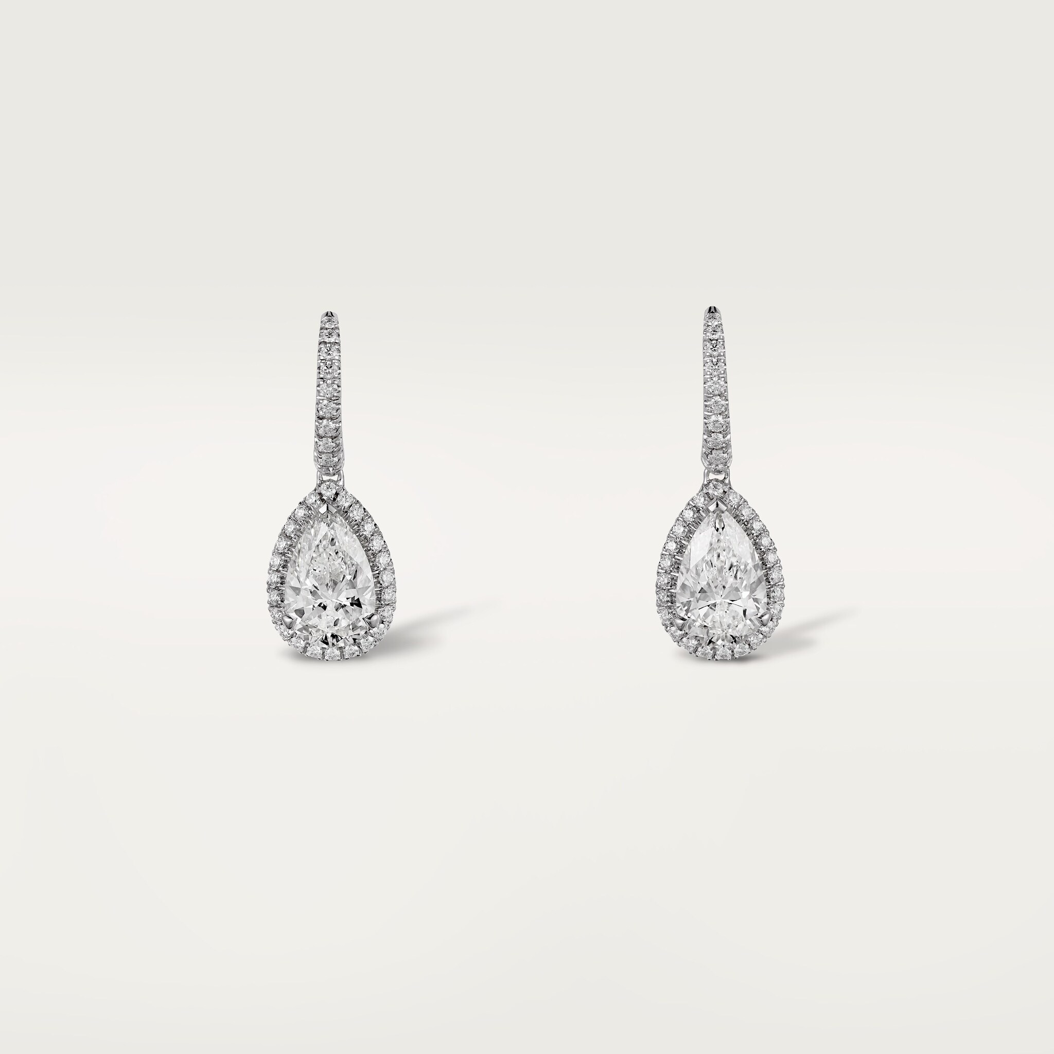 Cartier Destin&eacute;e sleeper earrings, 2 pear-shaped diamonds, paved