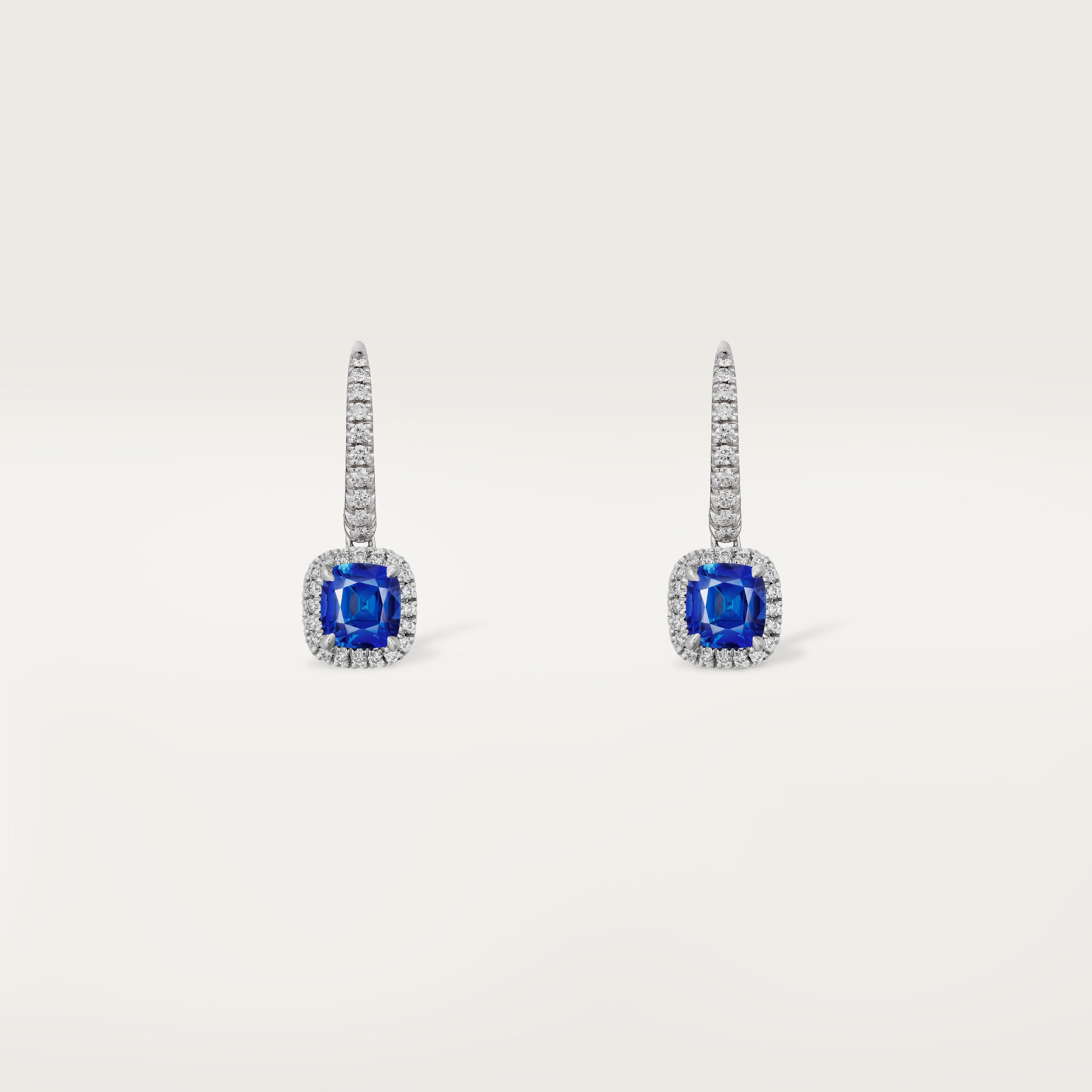 Cartier Destin&eacute;e sleeper earrings, 2 cushion-cut sapphires, paved