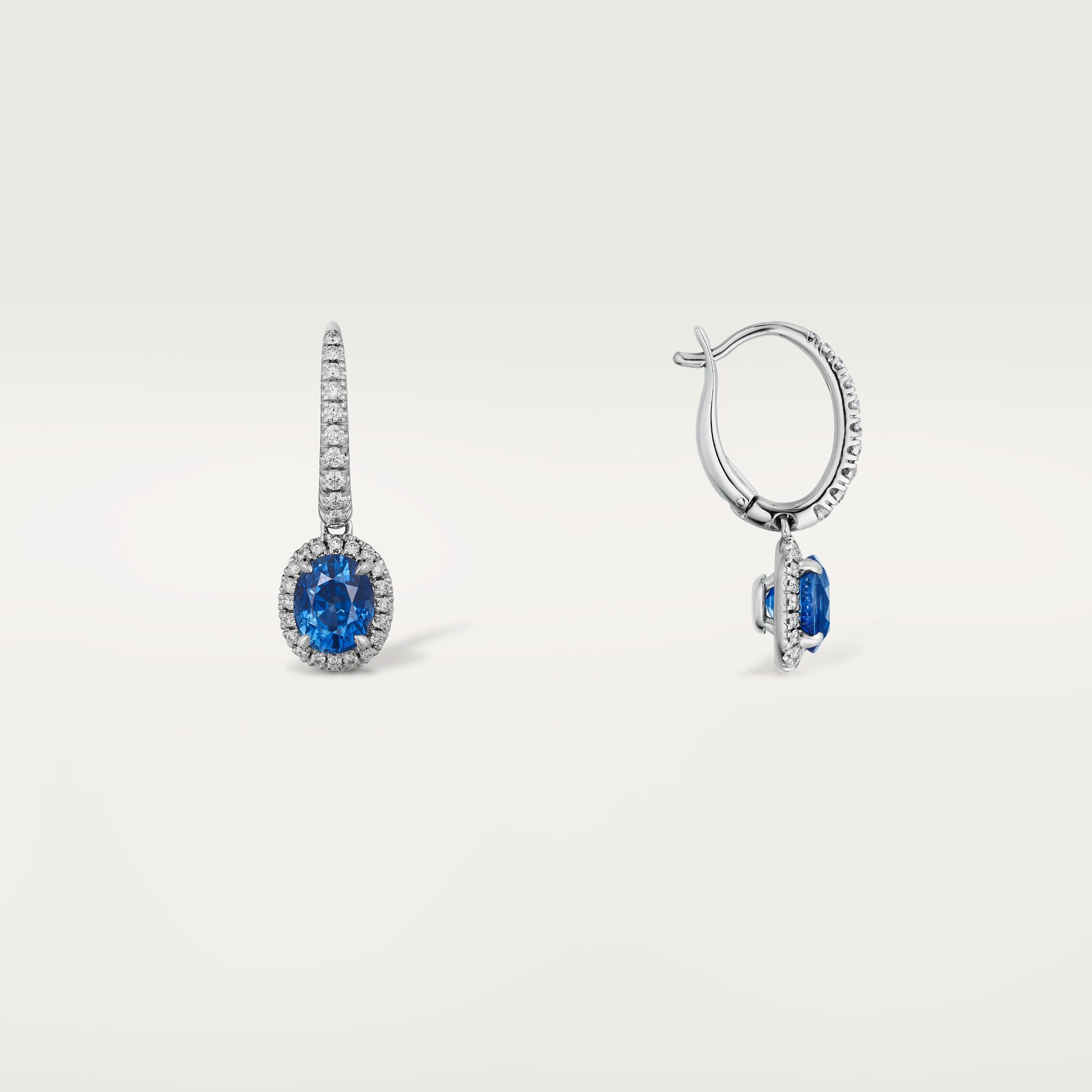 Cartier Destin&eacute;e sleeper earrings, 2 oval-cut sapphires, paved
