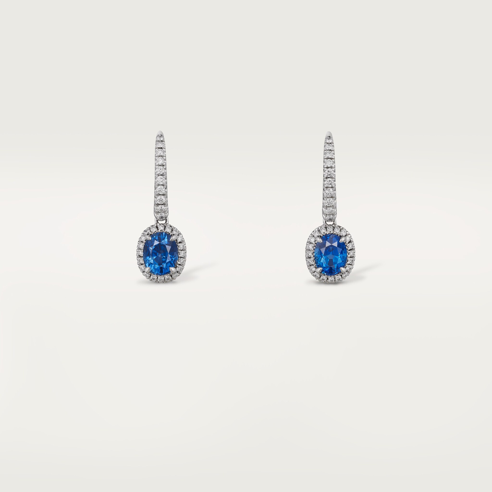 Cartier Destin&eacute;e sleeper earrings, 2 oval-cut sapphires, paved