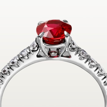1895 solitaire, oval-cut ruby, paved  1895 solitaire, oval-cut ruby, paved
