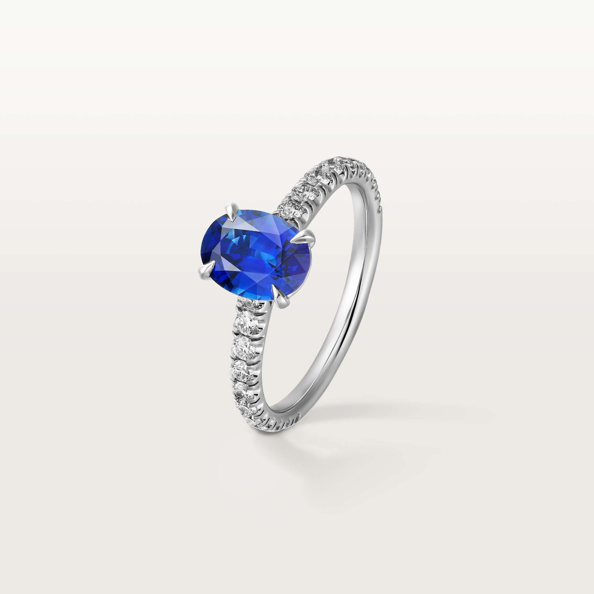 1895 solitaire, oval-cut sapphire, paved 