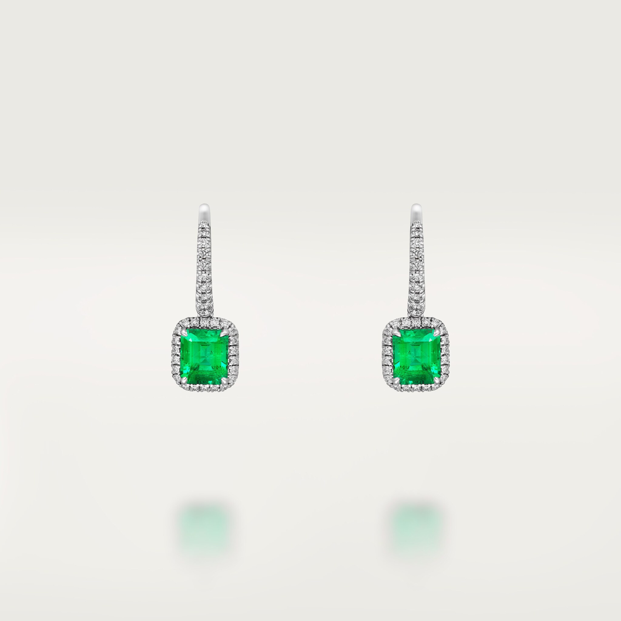 Cartier Destin&eacute;e sleeper earrings, 2 emerald-cut emeralds, paved