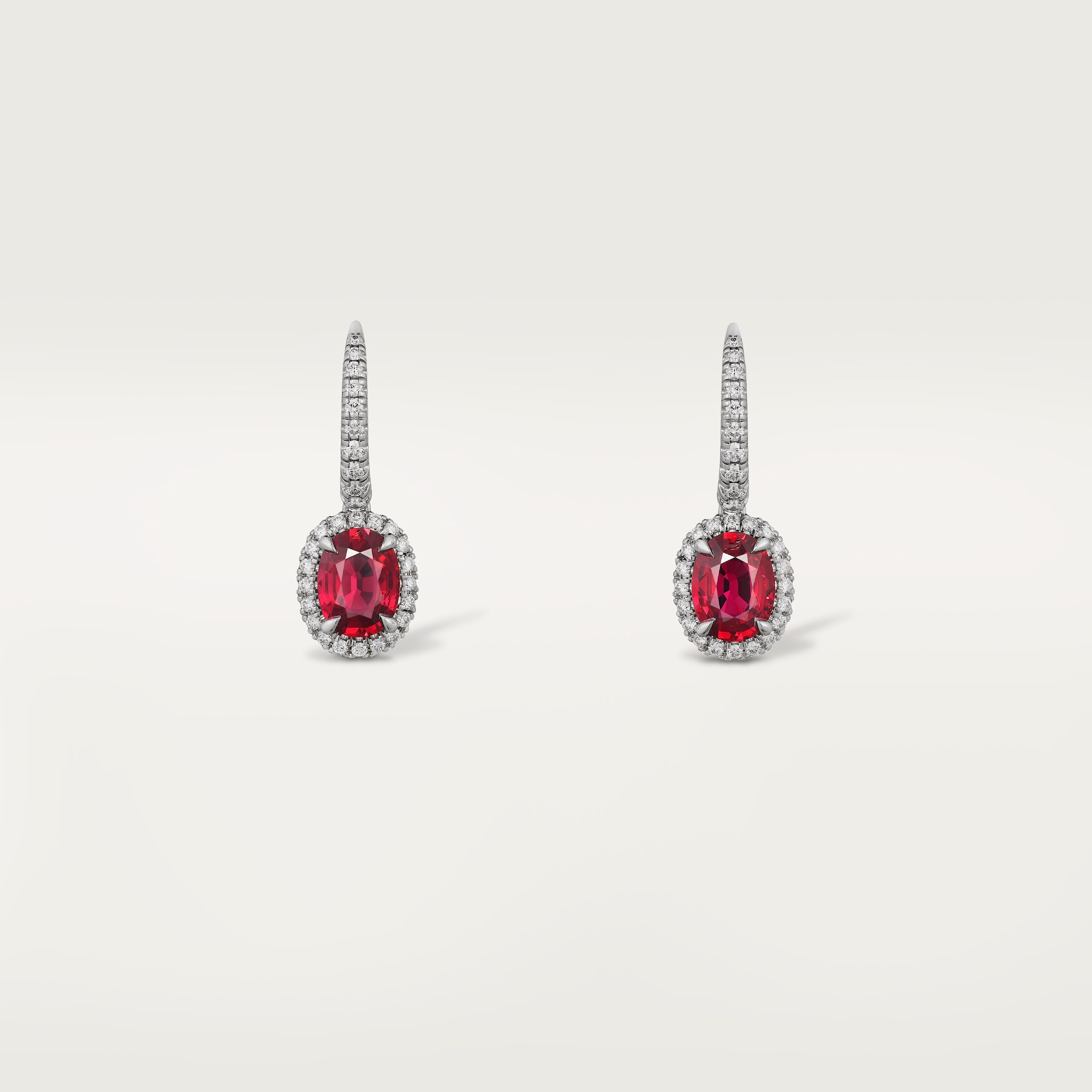 Cartier Destin&eacute;e sleeper earrings, 2 oval-cut rubies, paved