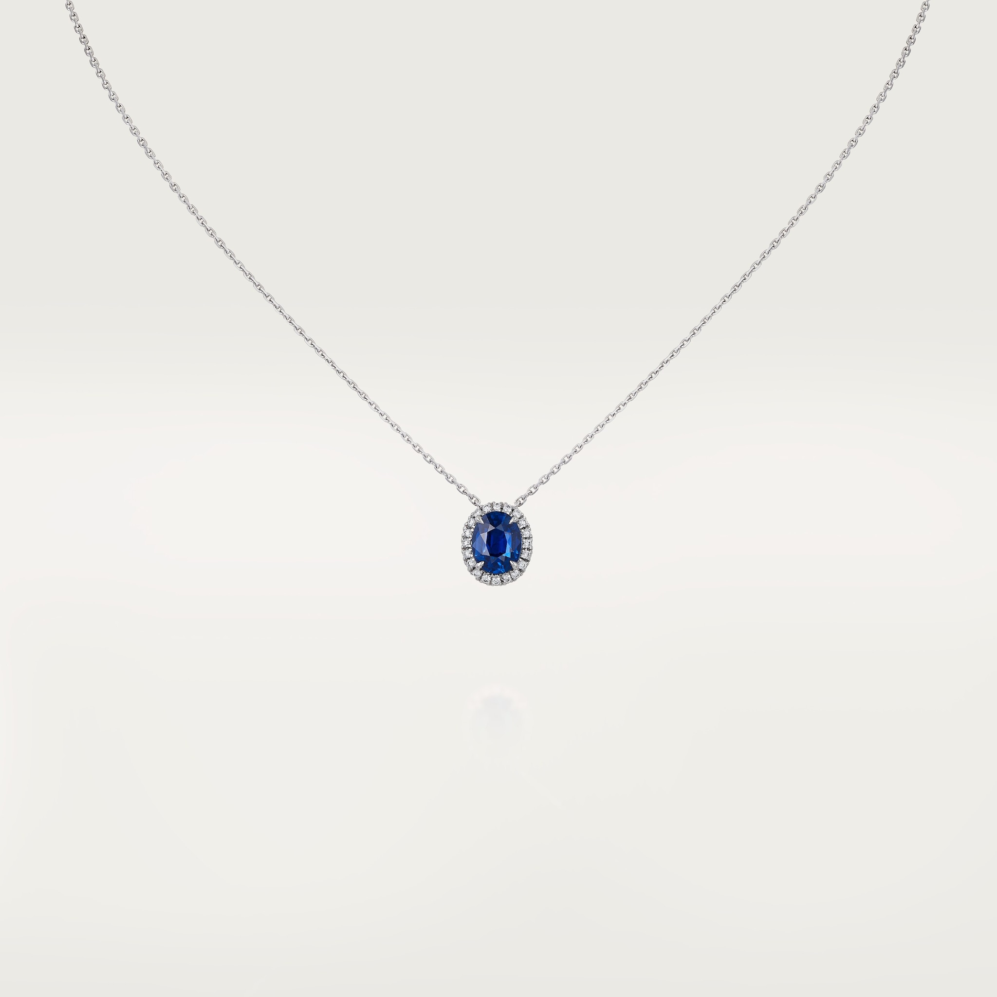 Cartier Destin&eacute;e pendant, oval-cut sapphire, paved 