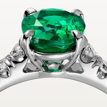 1895 solitaire, oval-cut emerald, paved  1895 solitaire, oval-cut emerald, paved
